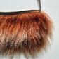 Orange mongolian fur shoulder bag