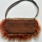 Orange mongolian fur shoulder bag